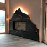 Partner 5 Kreative Metallgestaltung Hahnen Engelberg aus Metall Cheminee verkleidung